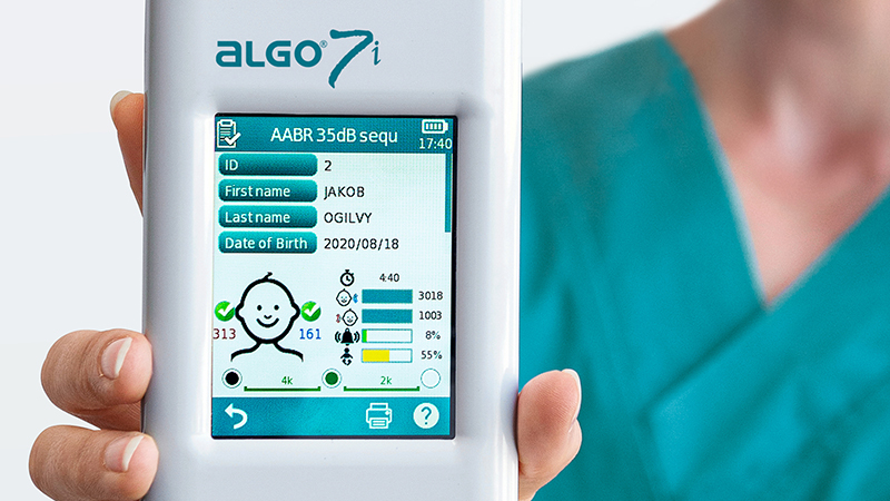 Close-up of ALGO 7i screen showing AABR results during infant hearing screening.