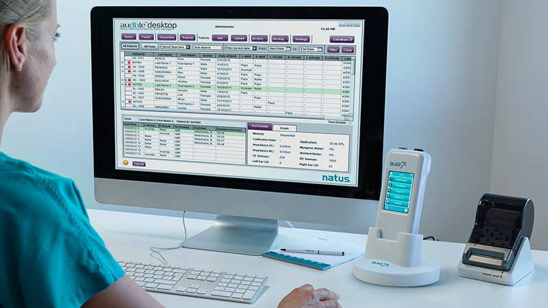 Clinician reviewing newborn hearing screening results from the Infant Hearing Screening Device ALGO 7i using desktop software.
